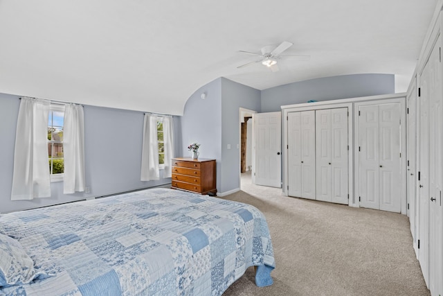 179 Alfred Rd, Kennebunk, ME 04043 - carpeted bedroom featuring multiple closets, a baseboard heating unit, and ceiling fan