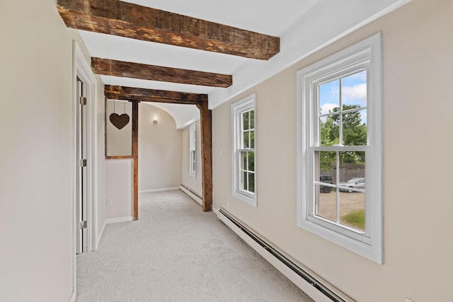 179 Alfred Rd, Kennebunk, ME 04043 - hall featuring baseboard heating, light colored carpet, beamed ceiling, and arched walkways