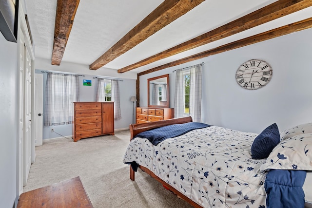 179 Alfred Rd, Kennebunk, ME 04043 - bedroom with multiple windows, carpet floors, and beam ceiling