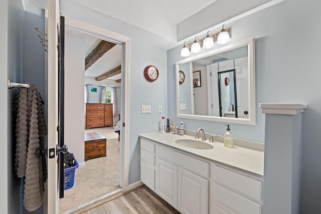 179 Alfred Rd, Kennebunk, ME 04043 - bathroom with wood finished floors, vanity, and beamed ceiling