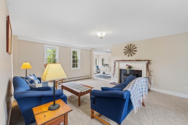 179 Alfred Rd, Kennebunk, ME 04043 - living room with light colored carpet, a glass covered fireplace, and baseboard heating