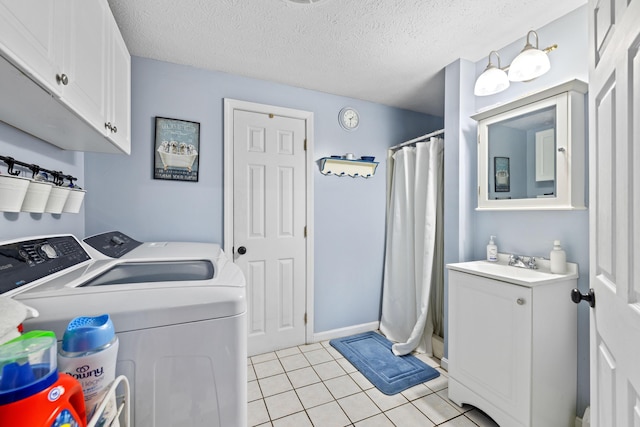 179 Alfred Rd, Kennebunk, ME 04043 - washroom with separate washer and dryer, light tile patterned floors, and a textured ceiling