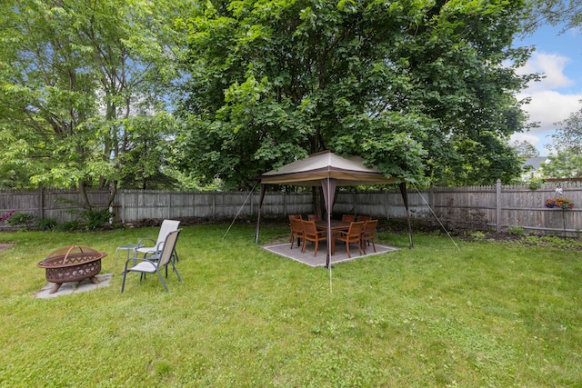 179 Alfred Rd, Kennebunk, ME 04043 - fenced backyard with a fire pit, a gazebo, and a patio