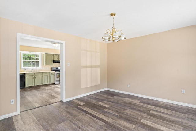 20 Huntington Ln, Berwick, ME 03901 - empty room featuring dark wood-style floors, a chandelier, baseboards, and a sink