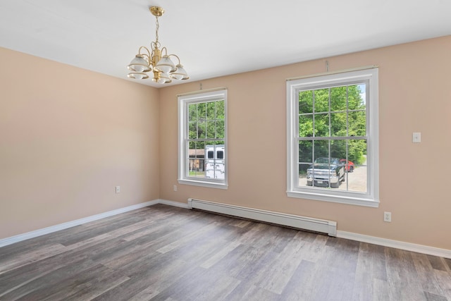 20 Huntington Ln, Berwick, ME 03901 - empty room with a baseboard radiator, a chandelier, wood finished floors, and baseboards