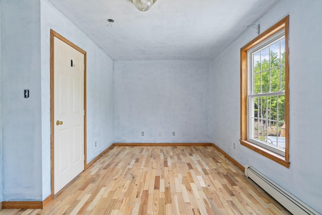 20 Huntington Ln, Berwick, ME 03901 - additional living space with baseboard heating, light wood-style flooring, and baseboards