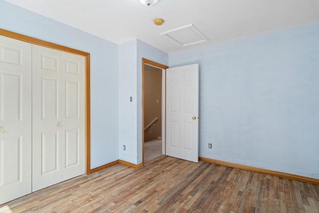 20 Huntington Ln, Berwick, ME 03901 - unfurnished bedroom with attic access, light wood-style flooring, baseboards, and a closet