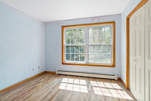 20 Huntington Ln, Berwick, ME 03901 - unfurnished room featuring a baseboard radiator, baseboards, and light wood-style flooring
