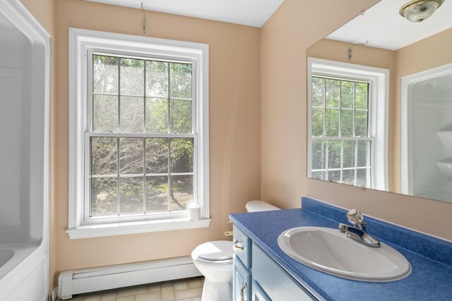 20 Huntington Ln, Berwick, ME 03901 - full bath with a baseboard heating unit, toilet, and plenty of natural light