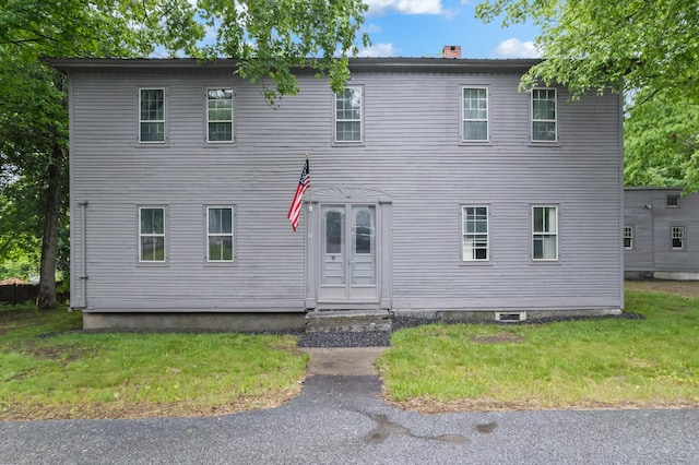 74 Main St, Cornish, ME 04020 - view of front of property with a chimney and a front lawn