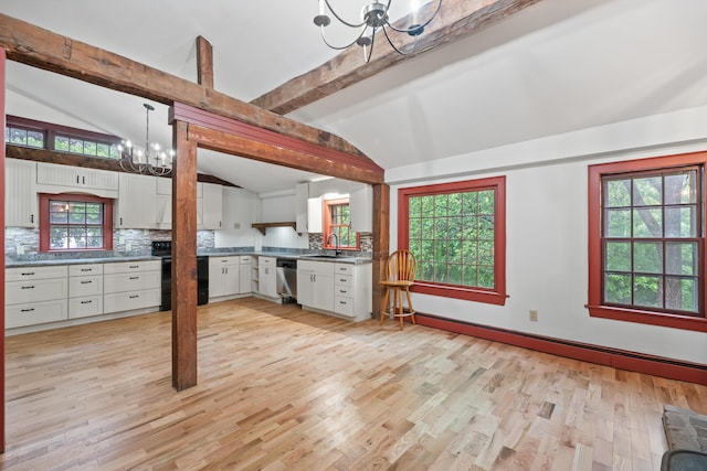 74 Main St, Cornish, ME 04020 - kitchen featuring a chandelier, stainless steel dishwasher, a sink, backsplash, and light wood finished floors