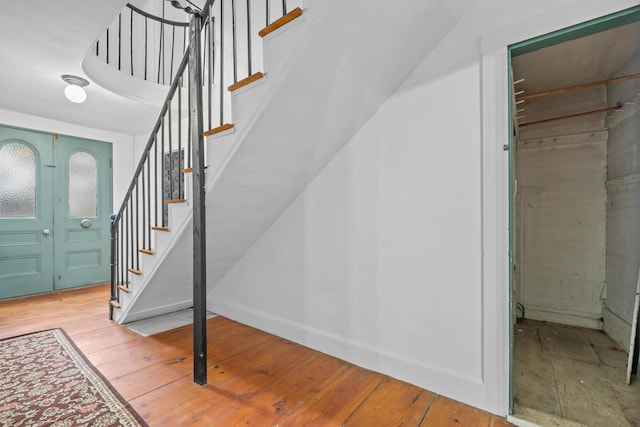 74 Main St, Cornish, ME 04020 - foyer entrance featuring hardwood / wood-style floors, stairs, and baseboards