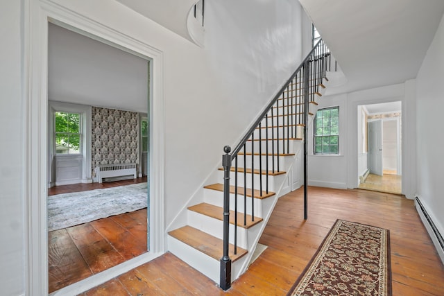 74 Main St, Cornish, ME 04020 - stairs with radiator heating unit, baseboard heating, hardwood / wood-style flooring, and baseboards