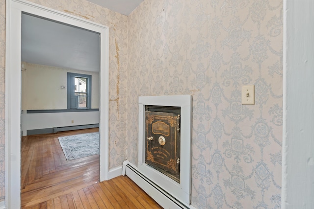 74 Main St, Cornish, ME 04020 - detailed view of baseboards, wood finished floors, and baseboard heating