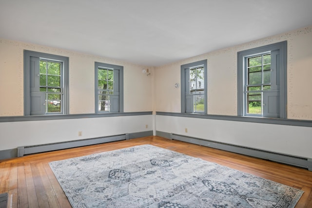 74 Main St, Cornish, ME 04020 - unfurnished room featuring baseboard heating and wood finished floors