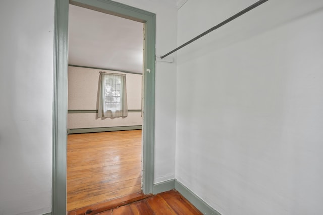 74 Main St, Cornish, ME 04020 - unfurnished room with a baseboard heating unit, hardwood / wood-style flooring, and baseboards