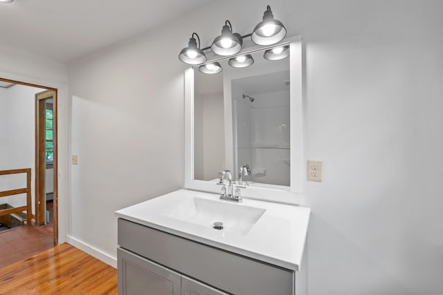 74 Main St, Cornish, ME 04020 - bathroom featuring vanity, wood finished floors, and baseboards