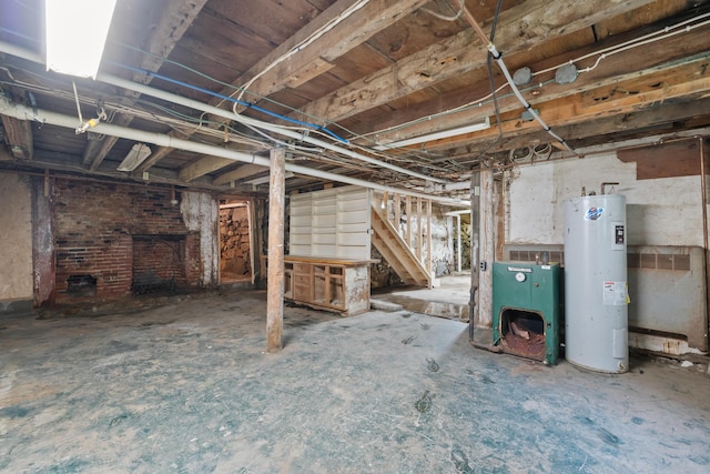 74 Main St, Cornish, ME 04020 - unfinished below grade area featuring water heater and stairs