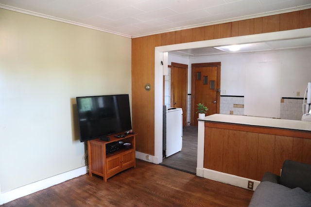 1 Chadwick St, Winslow, ME 04901 - kitchen featuring washer / clothes dryer, dark wood-style flooring, brown cabinetry, crown molding, and baseboards
