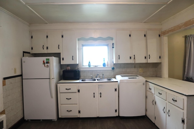 1 Chadwick St, Winslow, ME 04901 - kitchen featuring freestanding refrigerator, washer / dryer, a sink, black microwave, and white cabinets