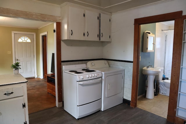 1 Chadwick St, Winslow, ME 04901 - laundry room with ornamental molding, dark wood-style flooring, and a sink