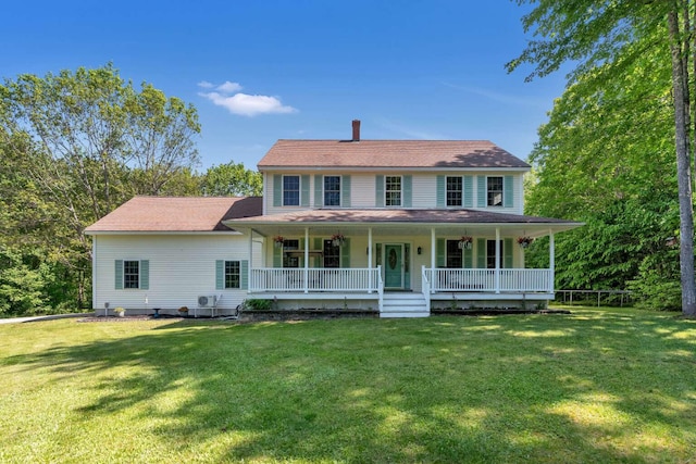 1505 Foxes Ridge Rd, Acton, ME 04001 - view of front facade with a porch, a front yard, and a chimney