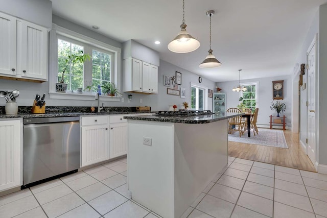 1505 Foxes Ridge Rd, Acton, ME 04001 - kitchen featuring appliances with stainless steel finishes, white cabinetry, dark stone countertops, light tile patterned floors, and hanging light fixtures