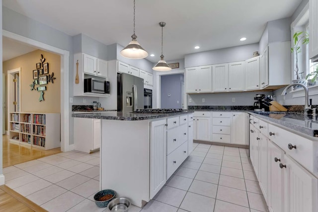 1505 Foxes Ridge Rd, Acton, ME 04001 - kitchen with appliances with stainless steel finishes, light tile patterned floors, white cabinets, recessed lighting, and dark stone countertops
