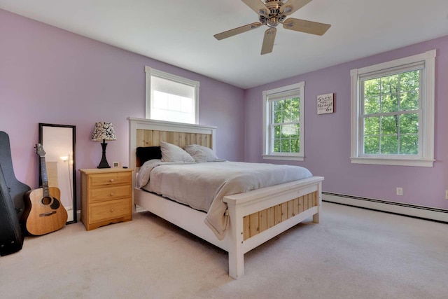 1505 Foxes Ridge Rd, Acton, ME 04001 - bedroom featuring light carpet, a baseboard radiator, and ceiling fan