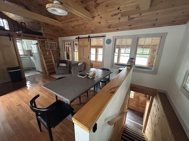 108 30th St, Shapleigh, ME 04076 - dining space featuring a barn door, light wood finished floors, and wood ceiling