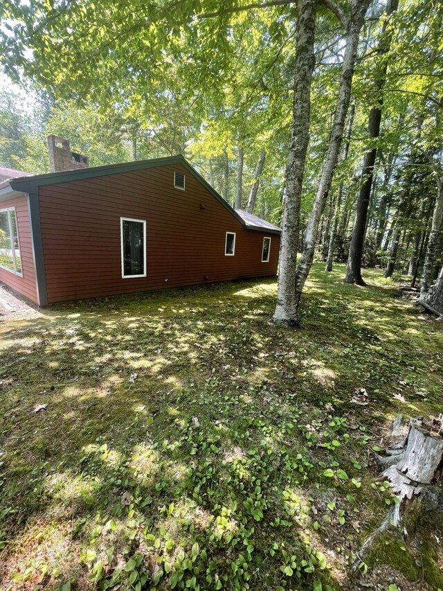 386 Lower Flying Point Rd, Freeport, ME 04032 - view of side of home featuring a chimney