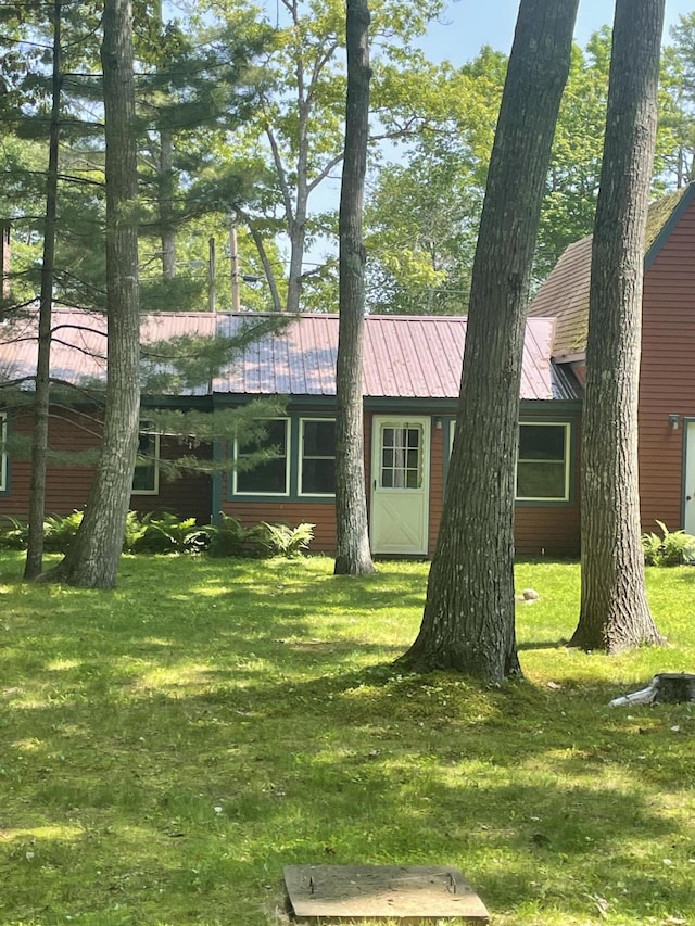 386 Lower Flying Point Rd, Freeport, ME 04032 - view of front of home featuring a front lawn and a metal roof