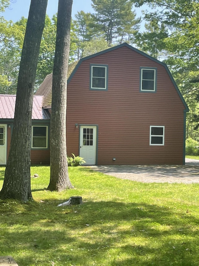 386 Lower Flying Point Rd, Freeport, ME 04032 - rear view of property featuring a yard, a patio, and a metal roof