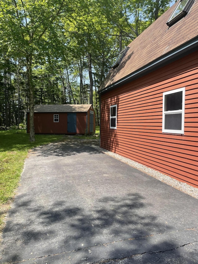 386 Lower Flying Point Rd, Freeport, ME 04032 - view of side of home featuring a storage unit