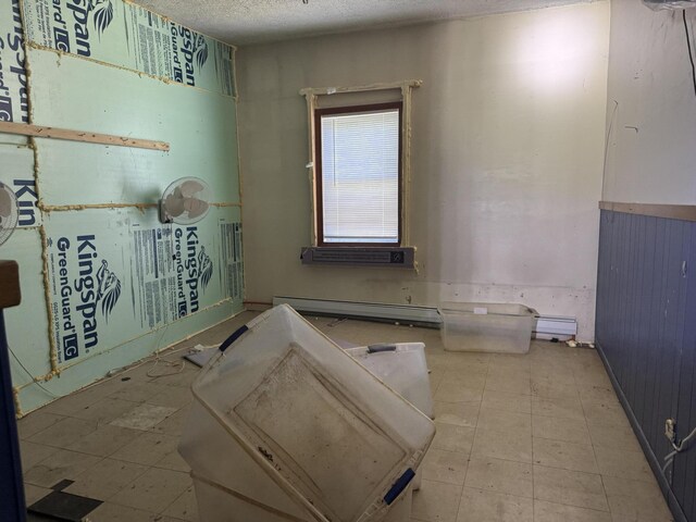 424 Maplecrest Rd, Parsonsfield, ME 04047 - bathroom with a baseboard heating unit and a textured ceiling