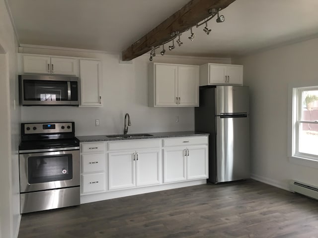 3 Baker St, Winslow, ME 04901 - kitchen with appliances with stainless steel finishes, a sink, white cabinets, dark wood-style flooring, and track lighting