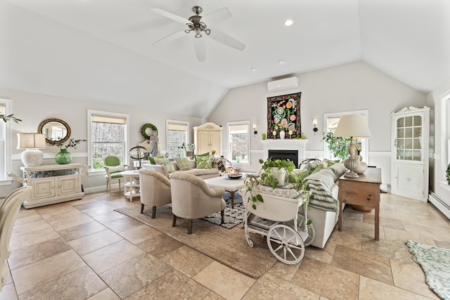 59 Meadow Ln, Ogunquit, ME 03907 - living room with stone tile floors, lofted ceiling, a wall mounted AC, plenty of natural light, and a fireplace
