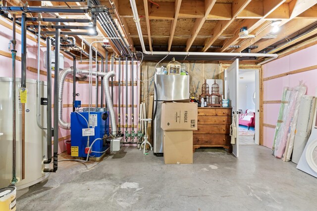 59 Meadow Ln, Ogunquit, ME 03907 - unfinished below grade area with a heating unit and freestanding refrigerator