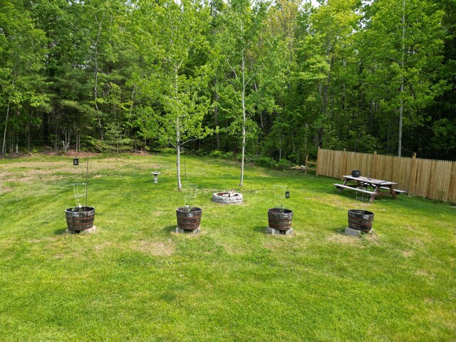 140 Station Rd, Lincoln, ME 04457 - view of yard with an outdoor fire pit and a forest view