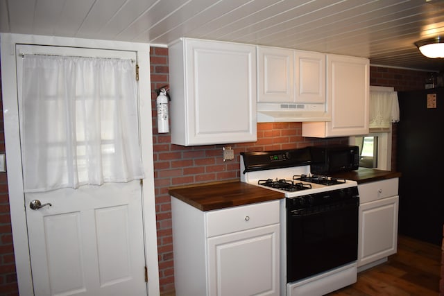 140 Station Rd, Lincoln, ME 04457 - kitchen with range with gas stovetop, under cabinet range hood, wooden counters, black microwave, and white cabinetry