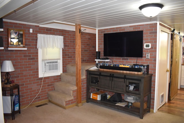 140 Station Rd, Lincoln, ME 04457 - carpeted living area with stairway and cooling unit