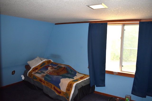 140 Station Rd, Lincoln, ME 04457 - bedroom with a textured ceiling and baseboards