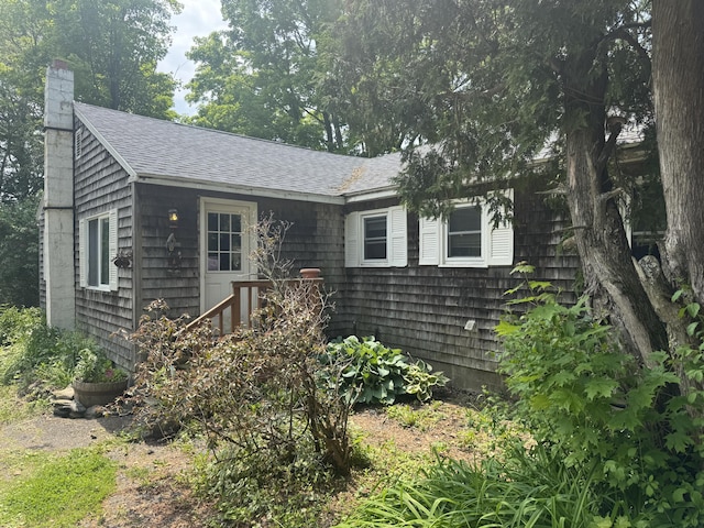 20 Coldbrook Rd, Hampden, ME 04444 - view of front facade with a shingled roof and a chimney