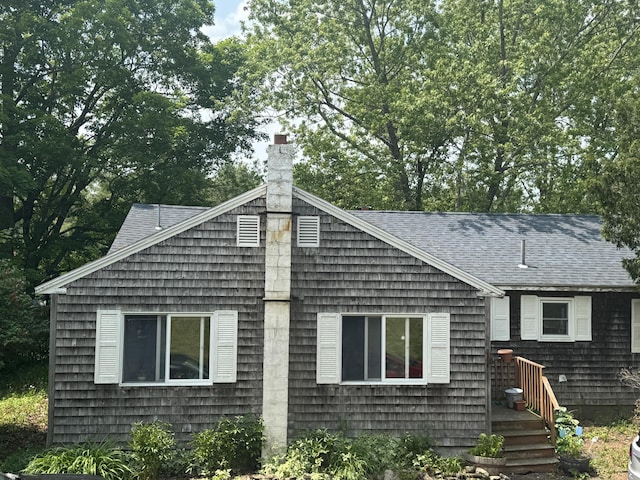20 Coldbrook Rd, Hampden, ME 04444 - view of front facade with a shingled roof and a chimney