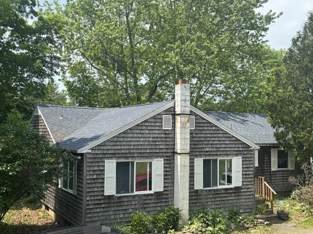 20 Coldbrook Rd, Hampden, ME 04444 - view of side of home with roof with shingles and a chimney