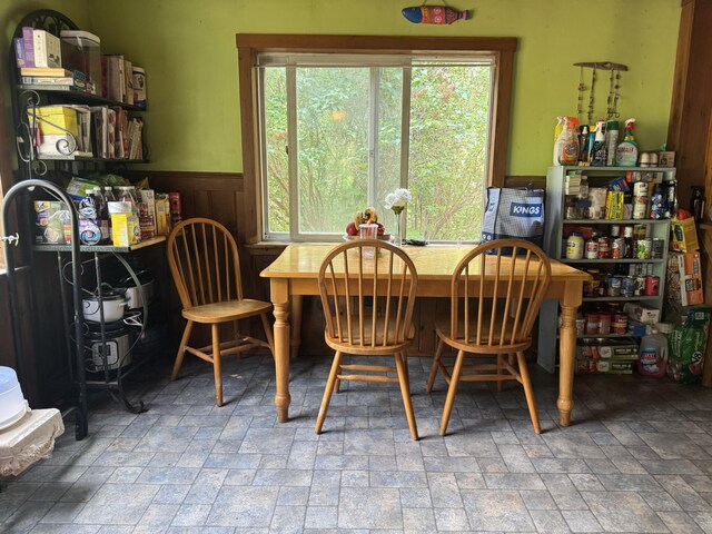 20 Coldbrook Rd, Hampden, ME 04444 - dining room with stone finish flooring, a wainscoted wall, and plenty of natural light