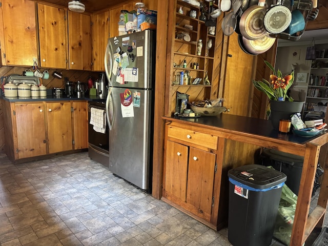 20 Coldbrook Rd, Hampden, ME 04444 - kitchen with appliances with stainless steel finishes, stone tile flooring, brown cabinetry, and dark countertops