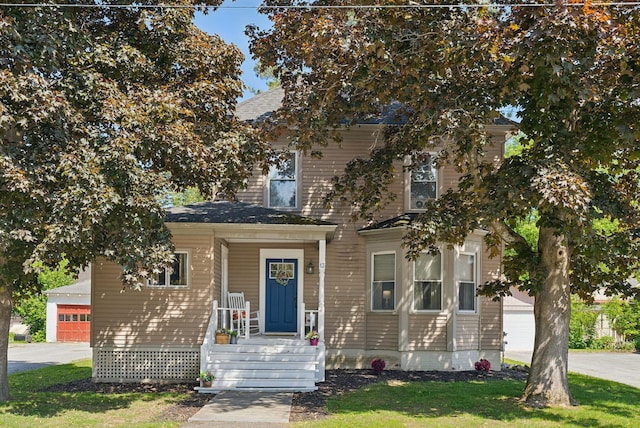 13 Bartlett St, Waterville, ME 04901 - view of front facade featuring a garage and a front lawn