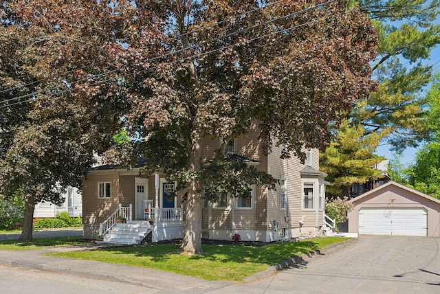 13 Bartlett St, Waterville, ME 04901 - view of property hidden behind natural elements featuring an outbuilding, a detached garage, and a front yard