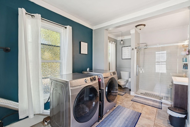 13 Bartlett St, Waterville, ME 04901 - laundry area with washer and dryer, light tile patterned floors, and ornamental molding